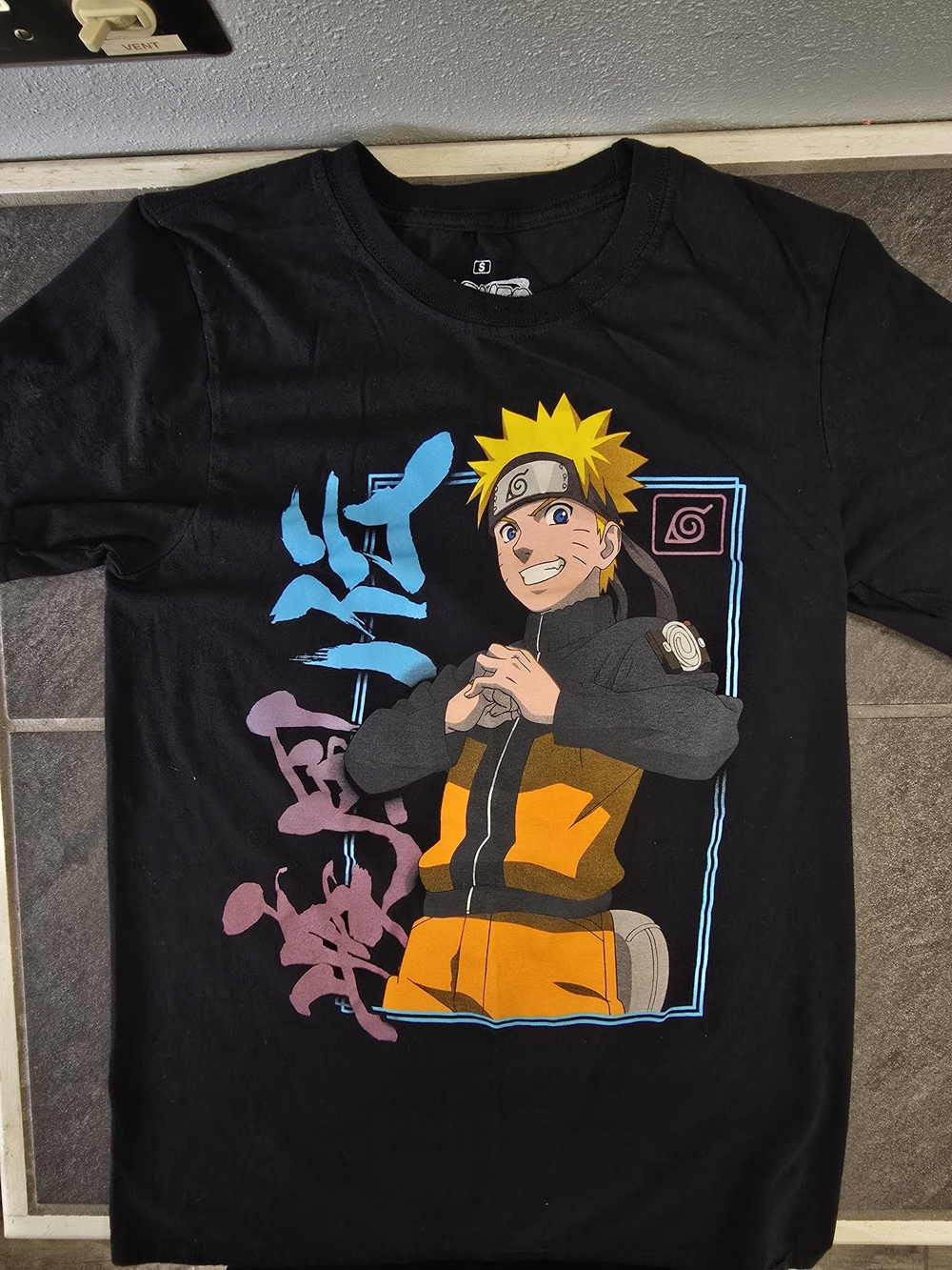 Ripple Junction Black Naruto Graphic Tee with Yellow & Orange Accents
